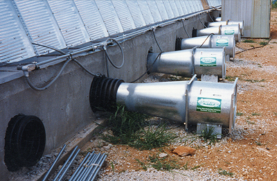 Shows fan systems through the cement wall upon which the building is constructed enable air to be pumped into the aerator tubes.