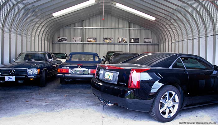 Car storage building pictured with multiple cars inside 