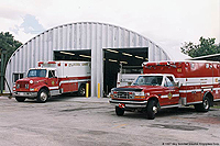 firefighting public service building with fire trucks outside 
