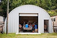 a smaller one of the  backyard sheds shown full of items 