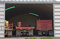 a photo taken from the outside of the building to show the inside of a truck storage model 