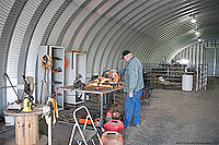 A man standing in a workshop 